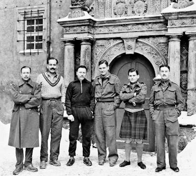 The very tall Rupert Barry (second from the left) along with 5 former POWs pictured here outside Castle Colditz after the war.
